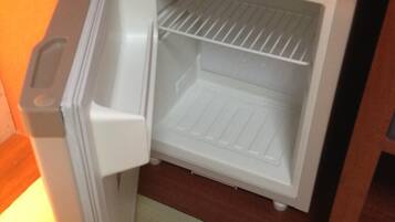 A compact refrigerator with a freezer compartment, built-in ice maker, and a water dispenser.