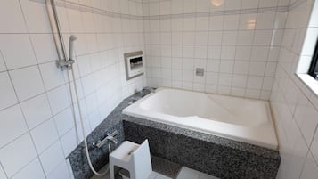 Separate bathtub and shower, free toiletries, hair dryer, bathrobes
