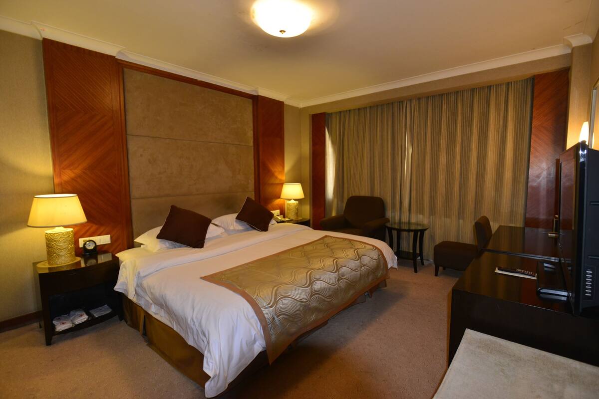 Minibar, desk, blackout curtains, iron/ironing board