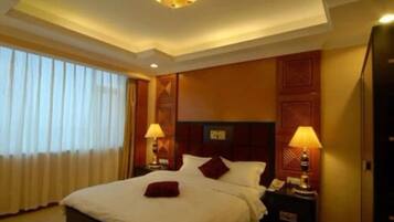 Minibar, desk, blackout curtains, iron/ironing board