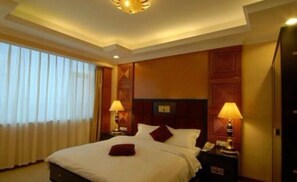 Minibar, desk, blackout curtains, iron/ironing board