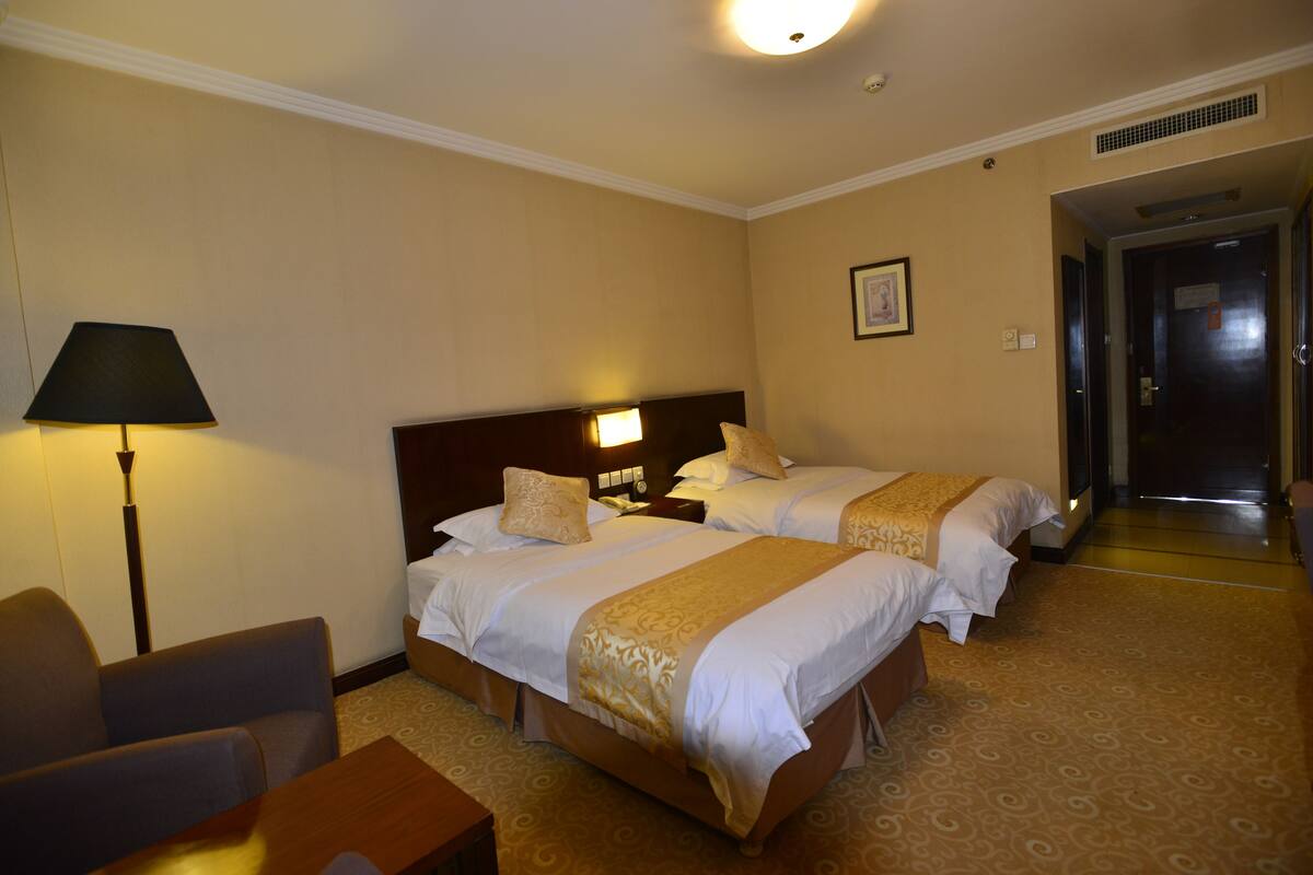 Minibar, desk, blackout curtains, iron/ironing board