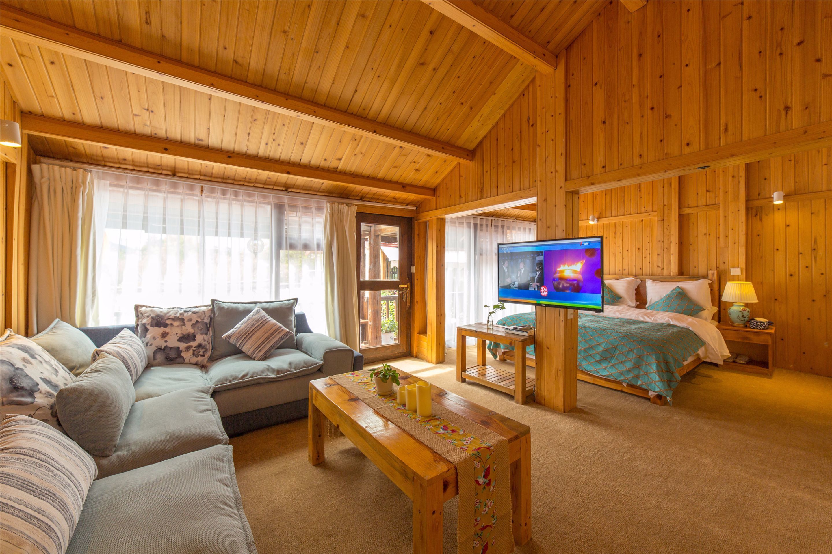 Boutique Suite With King Bed  | Living area | Flat-screen TV