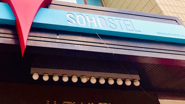 A hostel sign with the name 'SOHOSTEL' and a website address. - Sohostel Korea (Busan)
