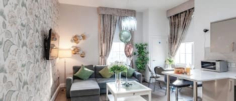 Deluxe Apartment, 2 Bedrooms | Living area | Flat-screen TV