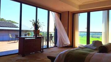 Deluxe Suite, Lake View | Minibar, in-room safe, desk, blackout drapes