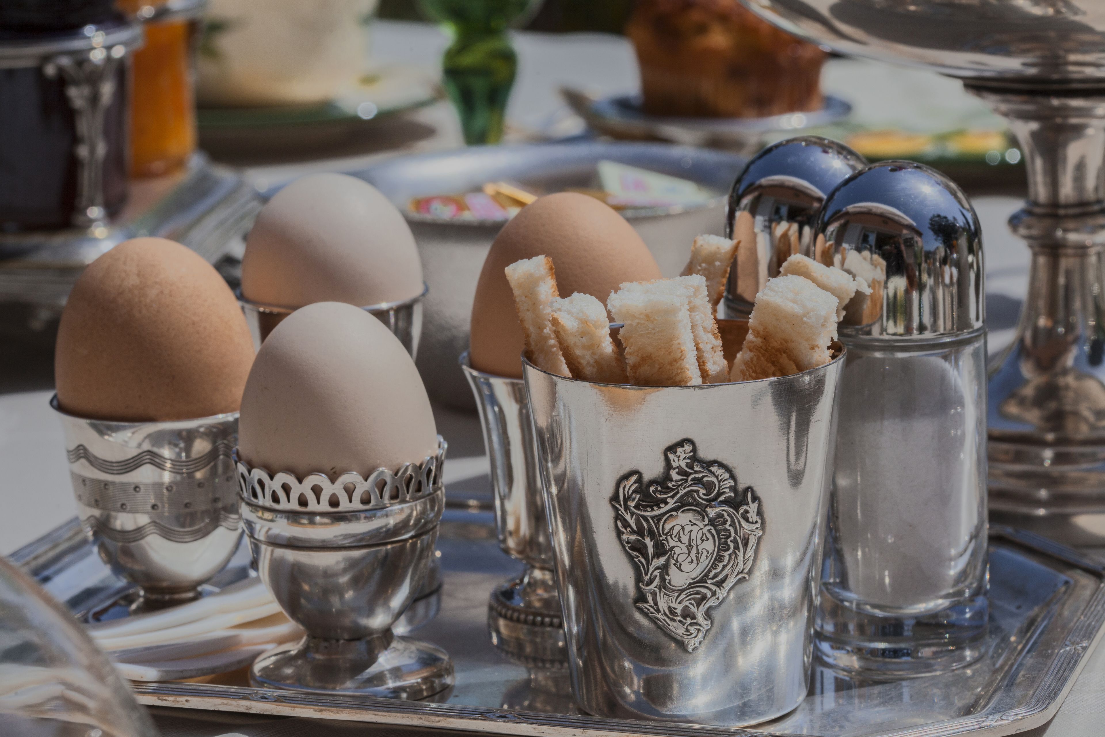 A tray with eggs and salt shakers.