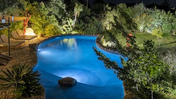 Seasonal outdoor pool, open 9:00 AM to 9:00 PM, pool umbrellas