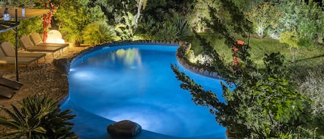 Seasonal outdoor pool, open 9:00 AM to 9:00 PM, pool umbrellas
