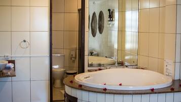 Suite, Jetted Tub | Bathroom | Hair dryer, towels