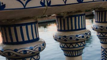 A series of blue and white patterned columns with intricate designs, likely part of a building's architecture.