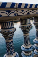 A series of blue and white patterned columns with intricate designs, likely part of a building's architecture.