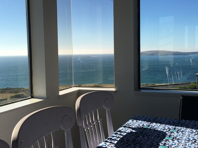 ON A BLUFF WITH 180 DEGREE CLOSE WATER VIEWS SHORT WALK TO THE BEACH