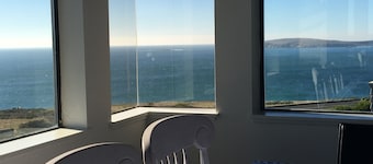 ON A BLUFF WITH 180 DEGREE CLOSE WATER VIEWS SHORT WALK TO THE BEACH