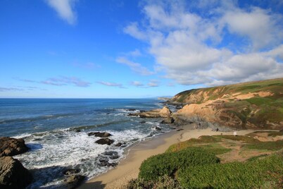 ON A BLUFF WITH 180 DEGREE CLOSE WATER VIEWS SHORT WALK TO THE BEACH