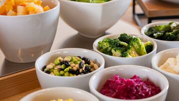 A variety of food bowls on a table.