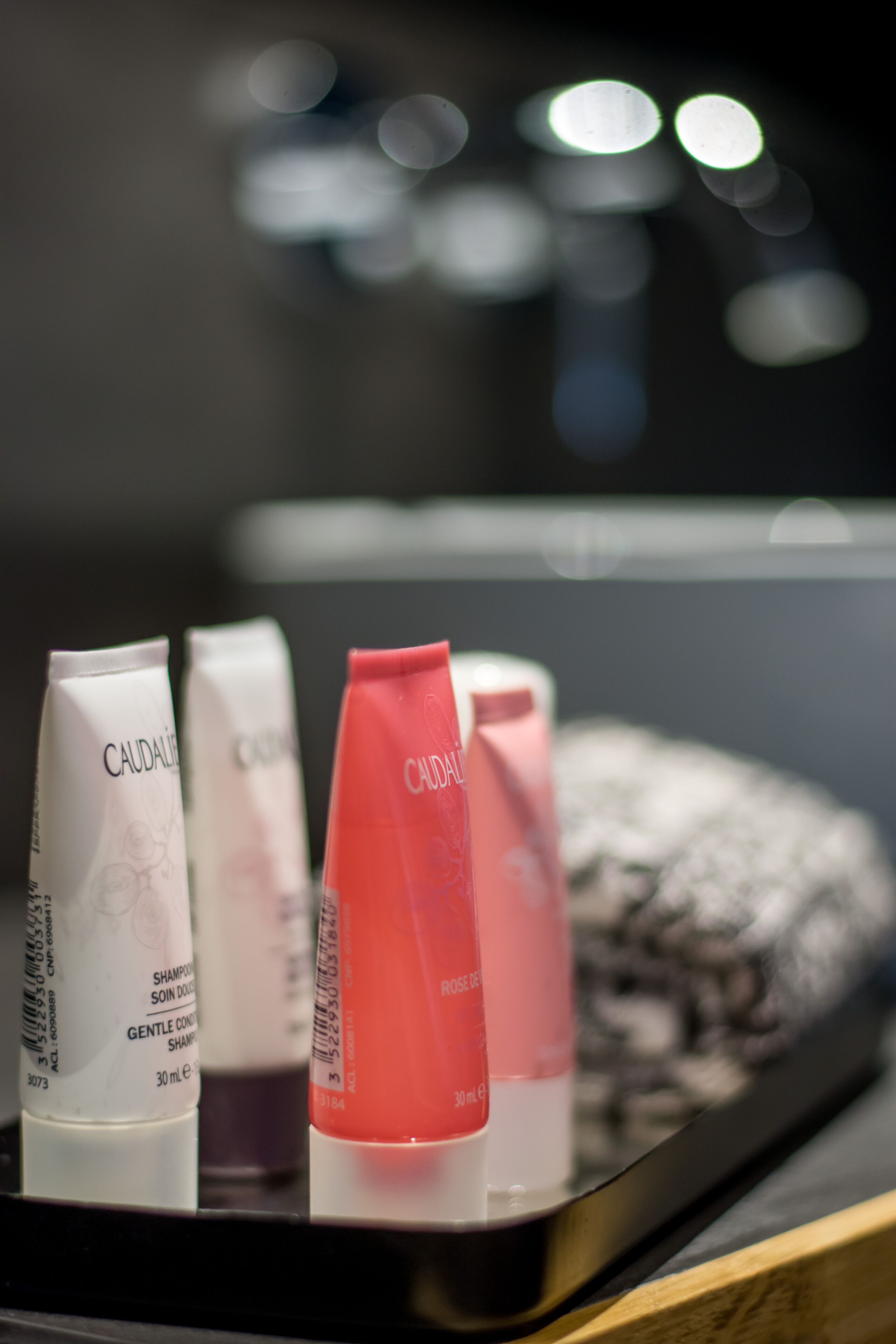 A display of Caudalie skincare products in a hotel setting.