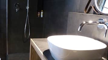 Shower, hair dryer, slippers, towels