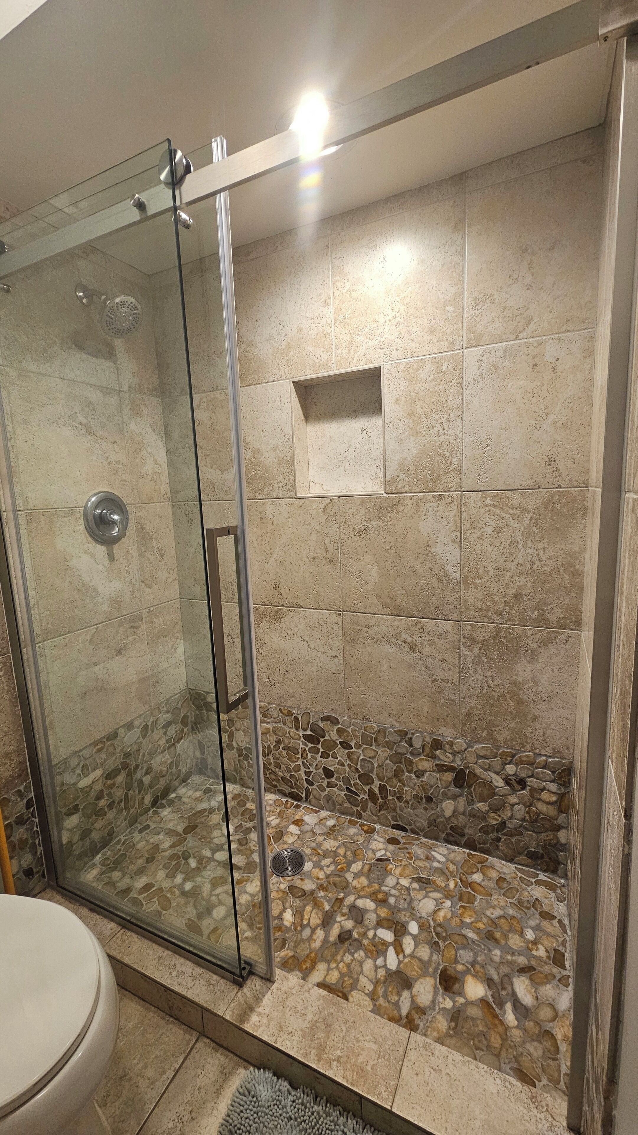 Shower, hair dryer, towels, toilet paper