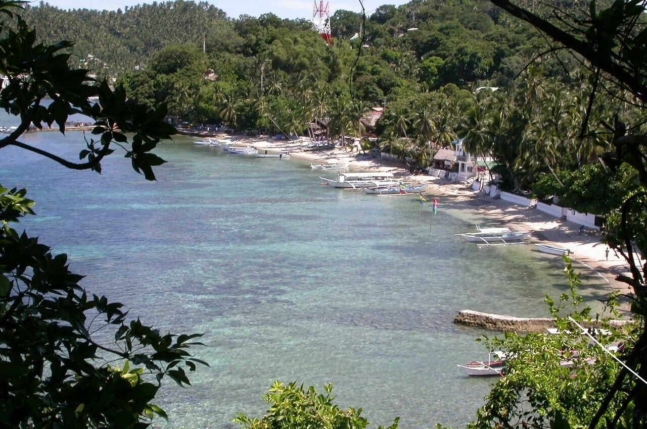 on the beach, white sand, beach towels, scuba diving