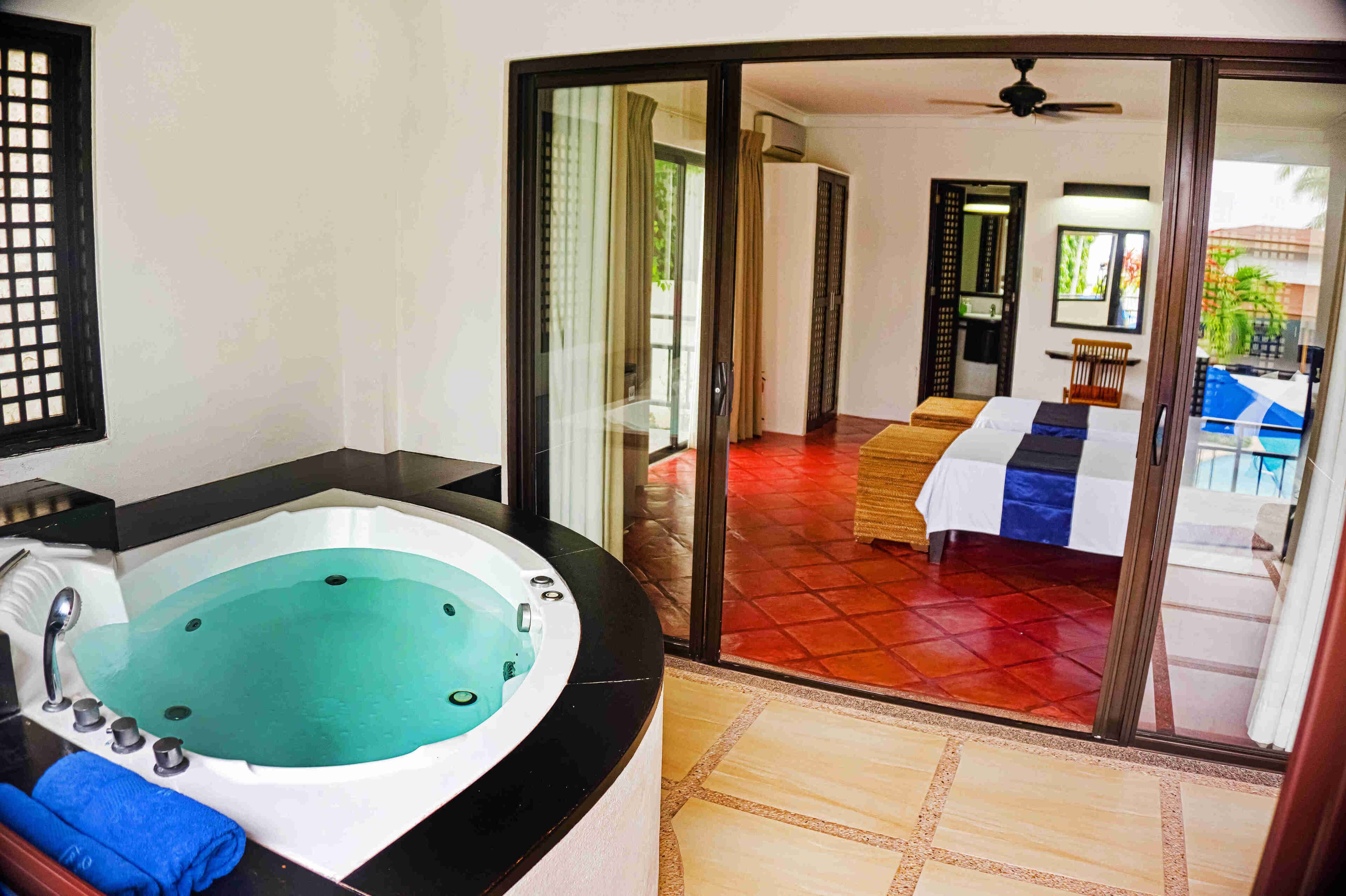 A bathroom with a bathtub, a shower, and a toilet.