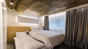 A modern hotel room with a large bed, a wooden headboard, a bedside table, and a window with curtains. - BAROATO 2nd (Seoul)