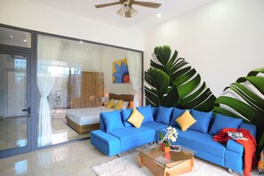 Basic Apartment | Living room | 40-inch LCD TV with cable channels, TV - Cavilla Hotel & Apartment (Da Nang)