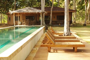 Family Deluxe Room | Outdoor pool | Outdoor pool, pool umbrellas, pool loungers
