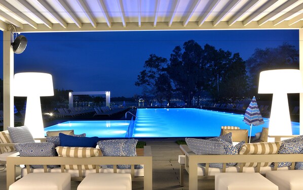 2 outdoor pools, open 10 AM to 7:30 PM, pool umbrellas, pool loungers