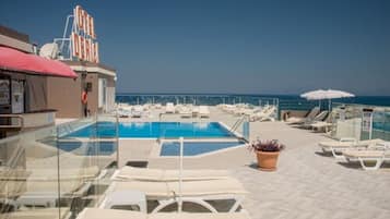 Indoor pool, outdoor pool, pool umbrellas, sun loungers