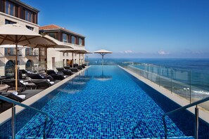 Seasonal outdoor pool, pool umbrellas, sun loungers