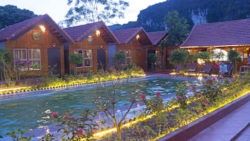 Outdoor pool, open 6:30 AM to 10:00 PM, pool loungers