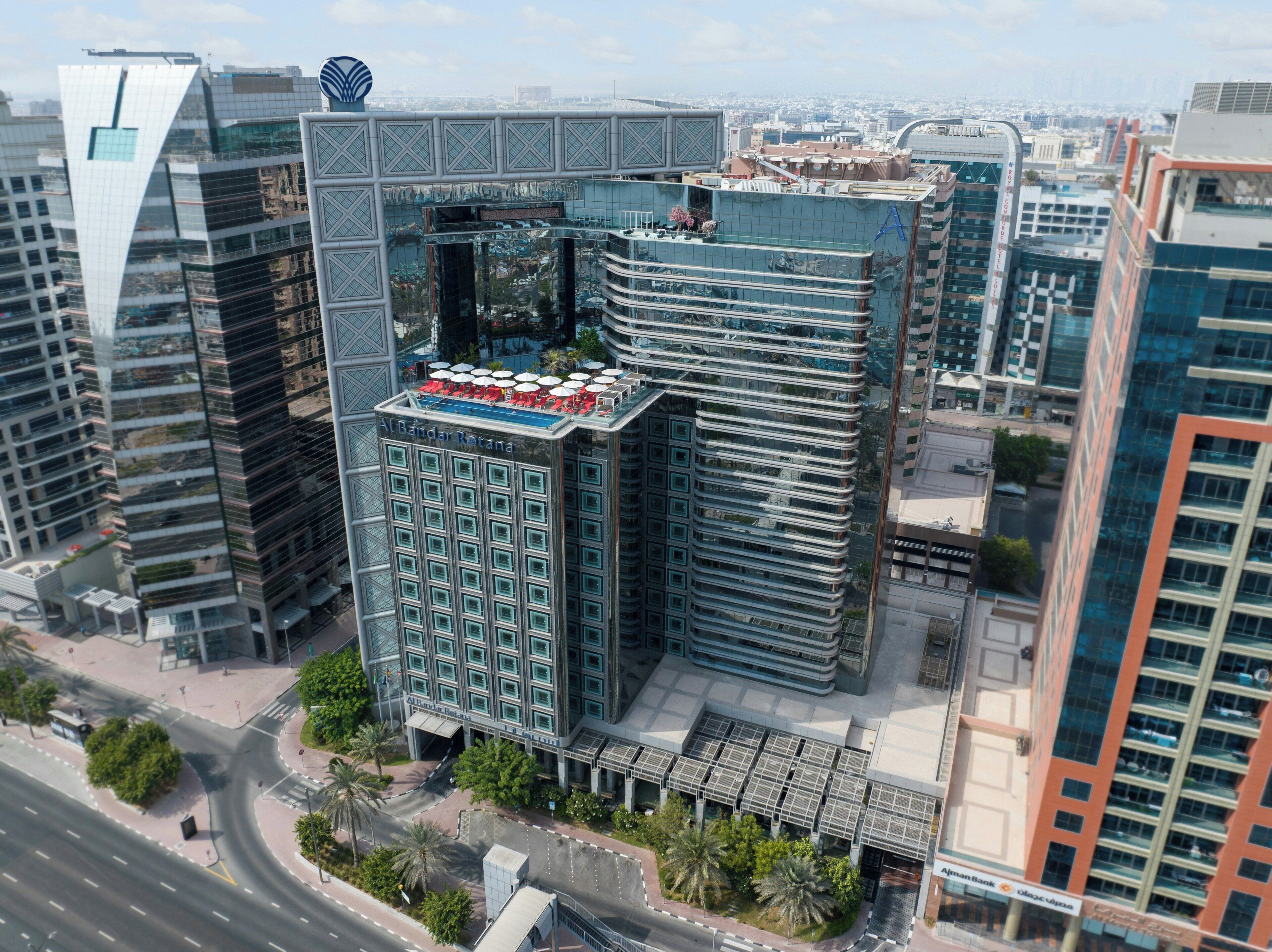 A high-rise building with a distinctive architectural design, featuring a central atrium and multiple floors.