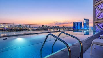 Outdoor pool, open 8:00 AM to 10:00 PM, free pool cabanas