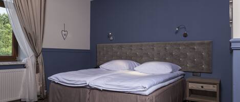 Double or Twin Room | Minibar, in-room safe, individually decorated, individually furnished