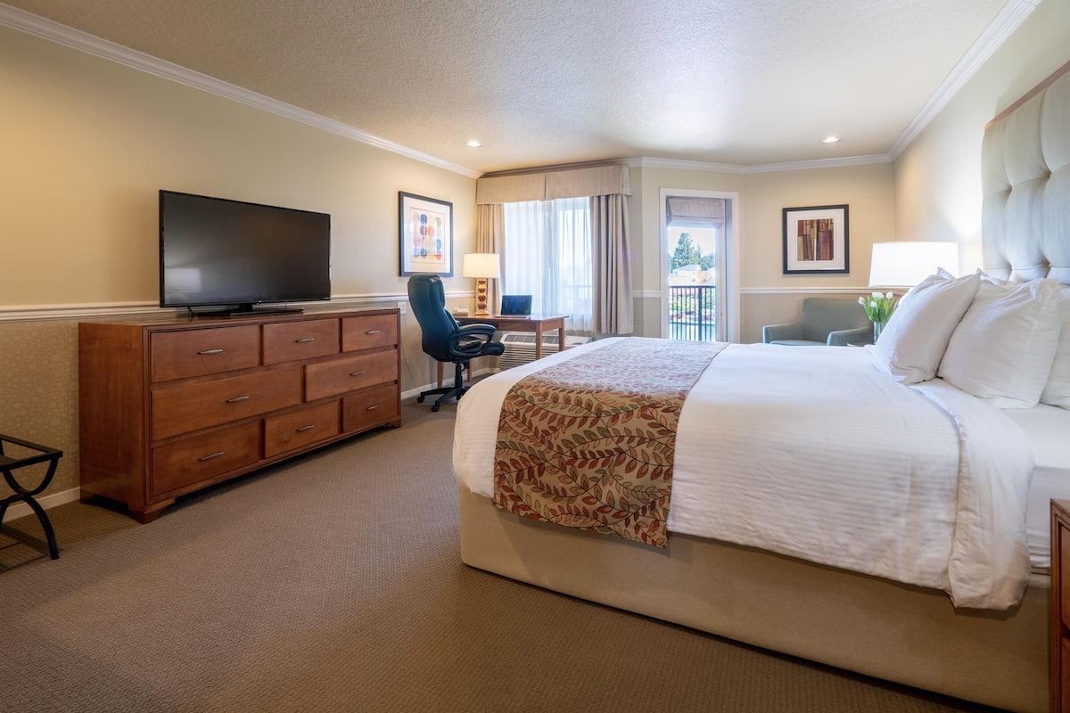 Premium bedding, desk, laptop workspace, iron/ironing board
