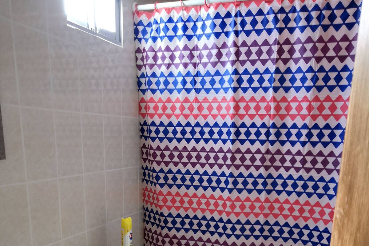 Shower, rainfall showerhead, towels, soap