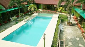 Outdoor pool, open 8 AM to 9 PM, pool umbrellas