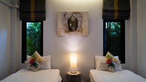 A hotel room with two beds, a nightstand with a lamp, a painting on the wall, and windows with curtains. - Ton Yaang Private Pool Villa (Krabi)