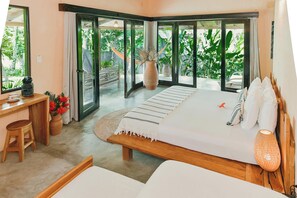 Deluxe Studio Suite, Multiple Beds, Partial Ocean View | Garden view - Villa Coco (Hicaco)