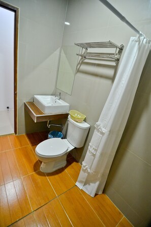 Shower, free toiletries, slippers, towels
