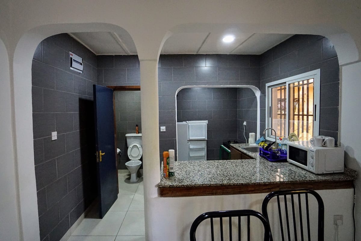 apartment, pool view | living area | flat-screen tv