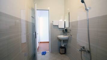 Shower, free toiletries, slippers, towels