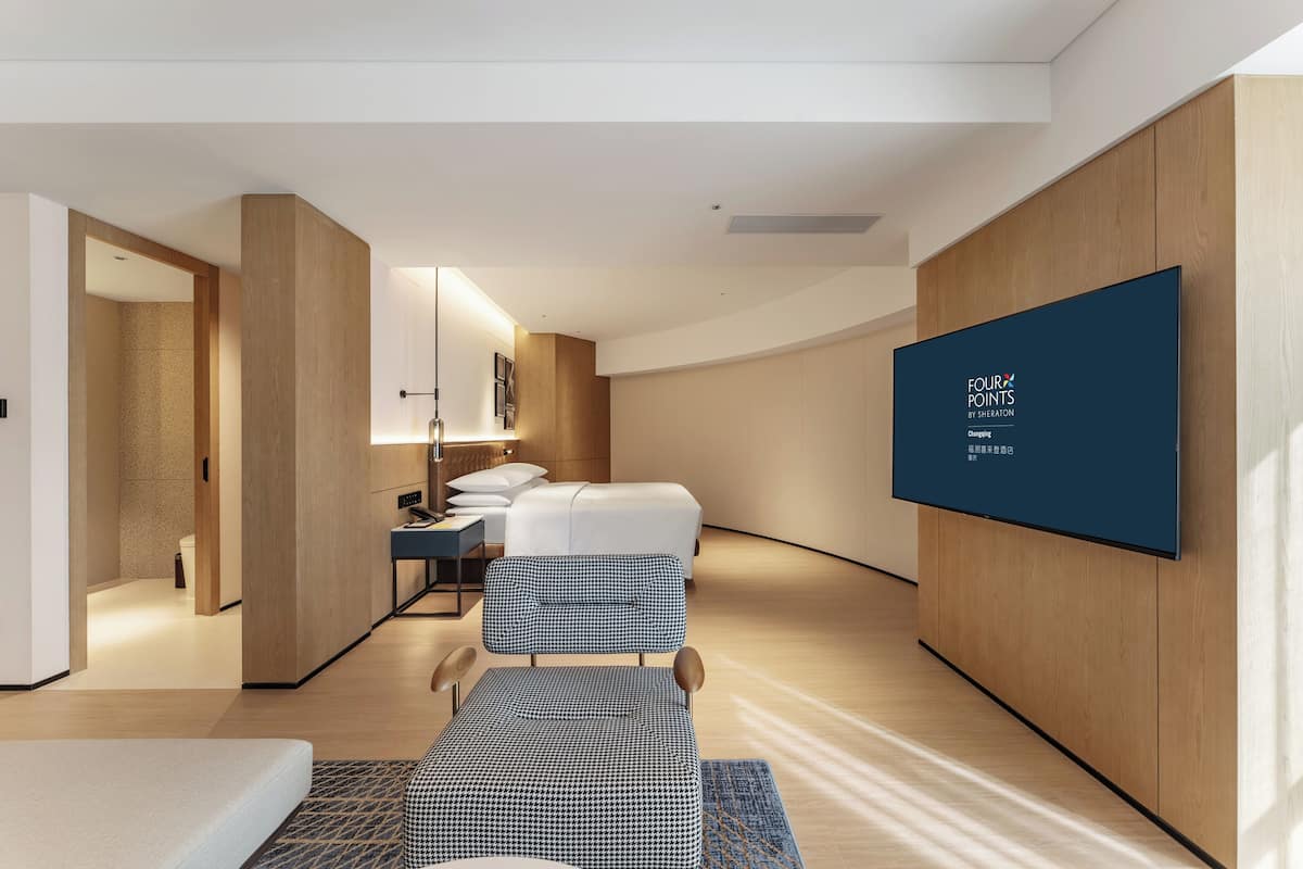 Suite, 1 King Bed, City View | Minibar, in-room safe, desk, blackout drapes