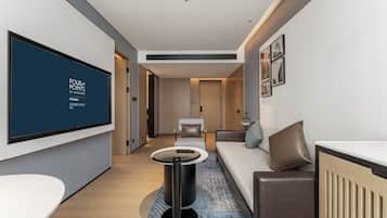 Signature Suite, 1 Bedroom | Living area | LCD TV