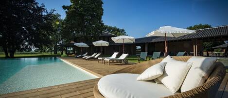 Seasonal outdoor pool, pool umbrellas, pool loungers