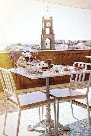 Dine in style with a beautifully set table, complete with a decorative centerpiece and a view of the surrounding area.