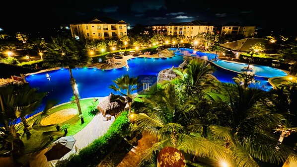 2 outdoor pools, open 8:00 AM to 8:00 PM, free cabanas, pool umbrellas