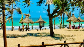 On the beach, white sand, free beach cabanas, sun-loungers