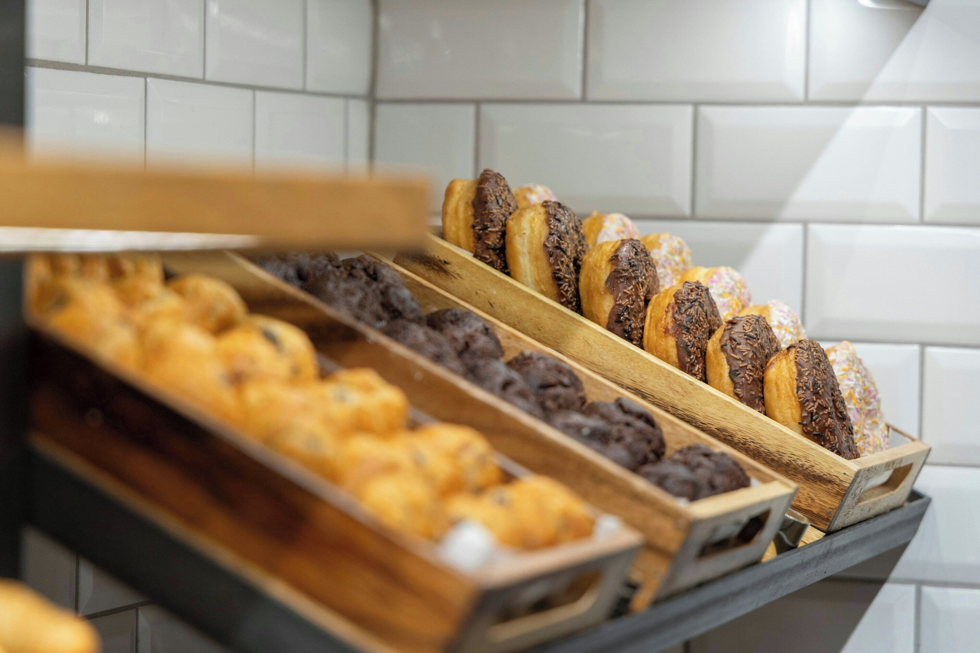 A display of assorted pastries in a bakery setting.